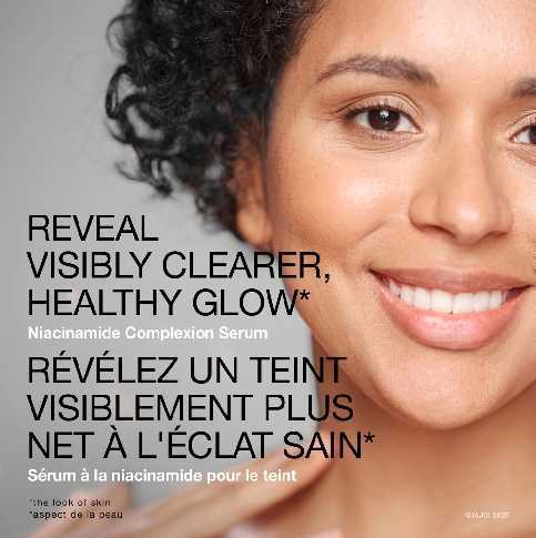 A woman smiling with the text 'reveal visibly clearer, healthy glow'