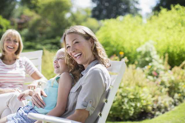 Woman smiling outside with family